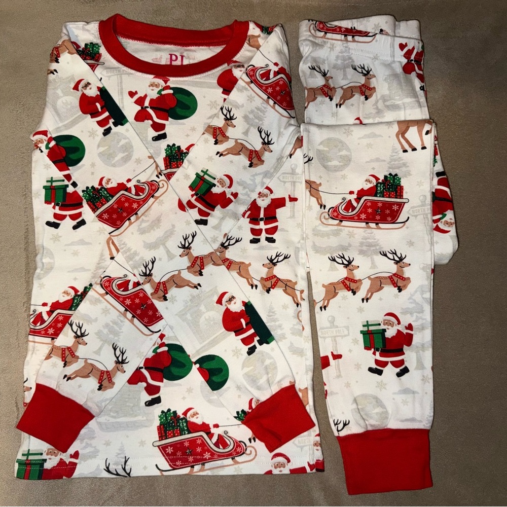 The Children's Place Red and White Pajama Set with Festive Santa Print